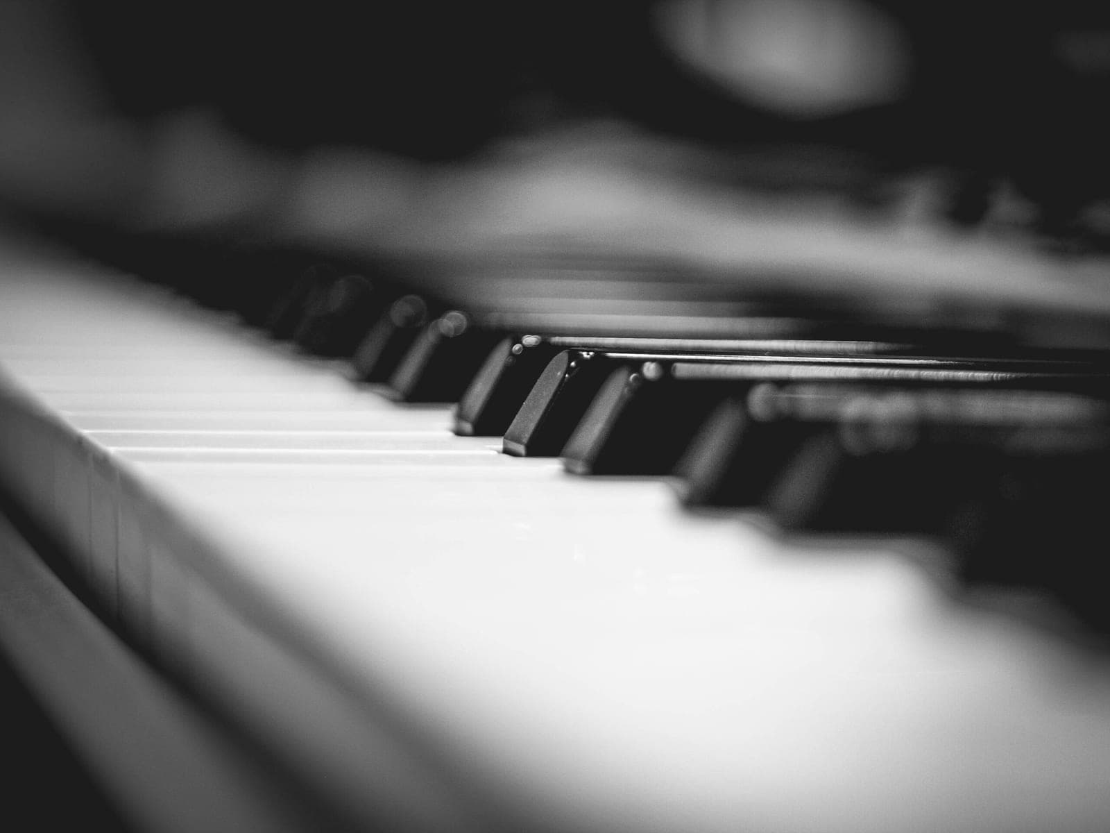 Dramatic close-up of piano keys