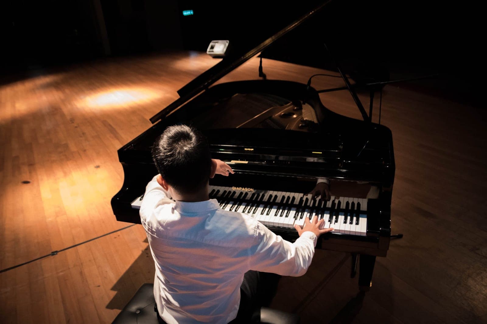 A child playing a grand piano